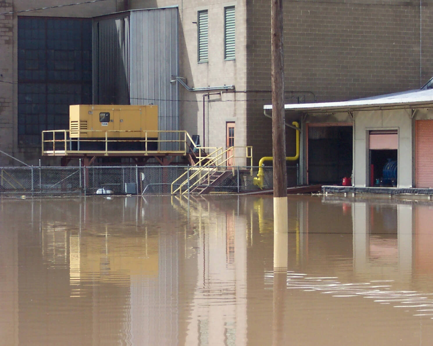 Floodwater rising to the edge of a loading dock