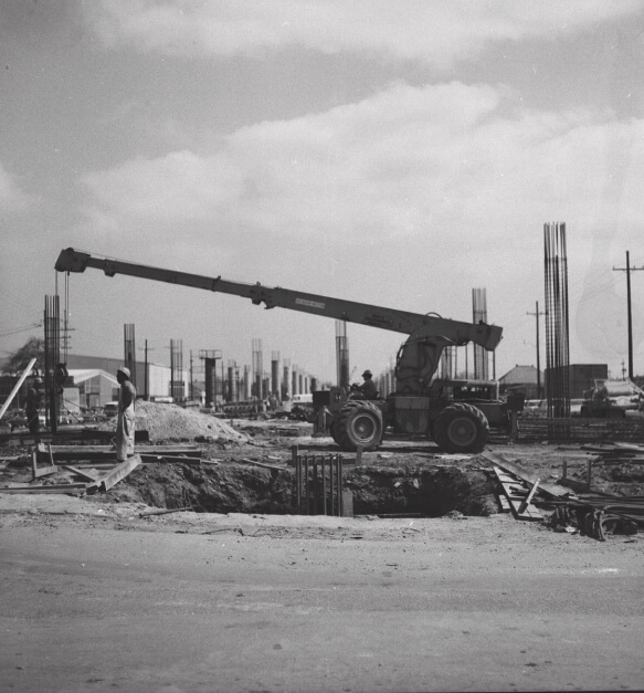 A historical photograph showing highway construction