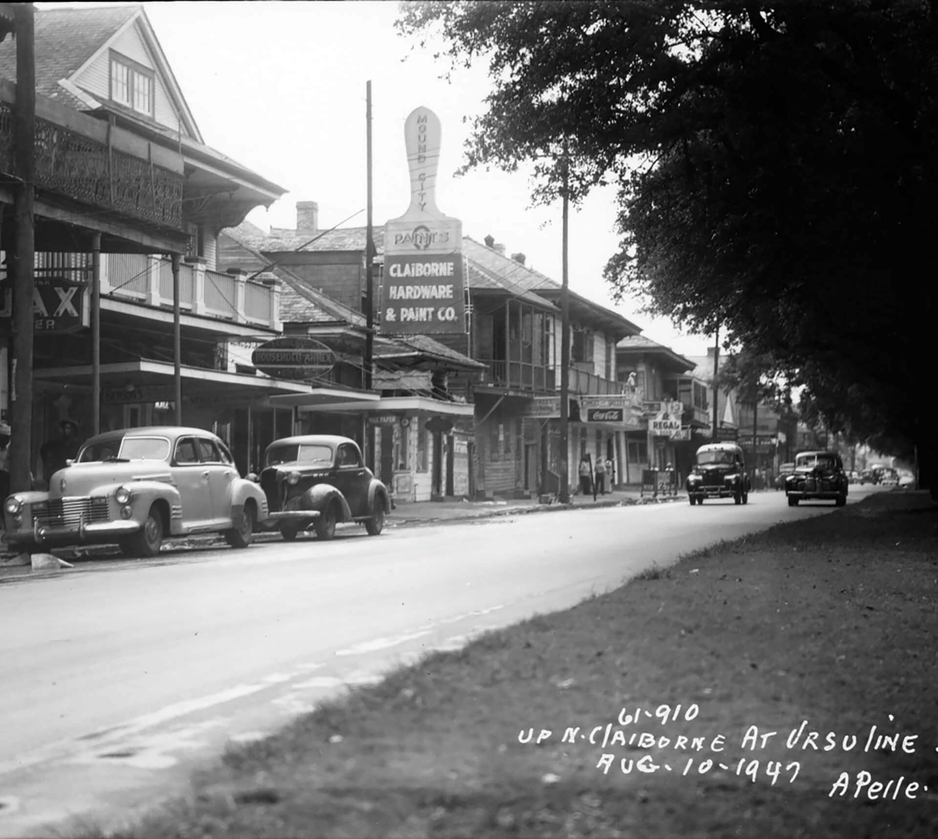 A historical photograph of Claiborne Avenue near Claiborne Hardware and Paint Co