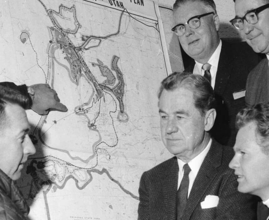 A group of five people looking at a map of Park City, Utah and plans for development