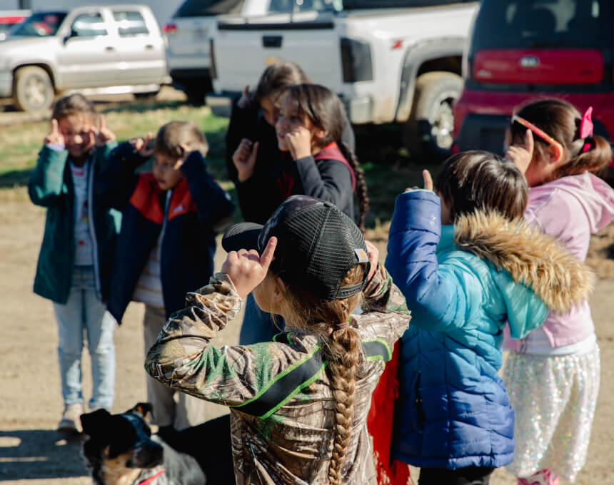 Children from the Wakanyeja Tokeyahci Lakota Immersion School perform a buffalo dance together