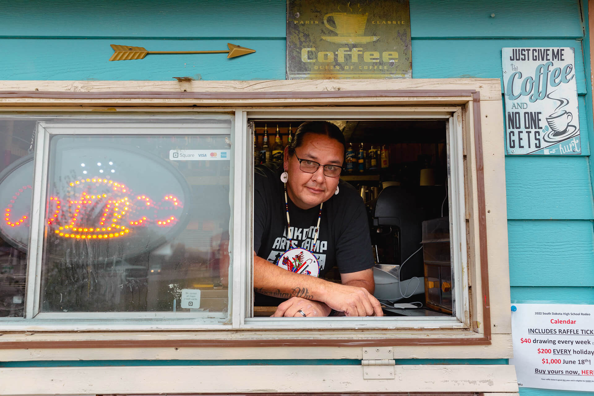 Shane Red Hawk works at his daughter's coffee cart