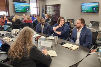 People talking at a table at the Economic Recovery & Resilience Community Conversation.  E. Kentucky, March 30, 2023.