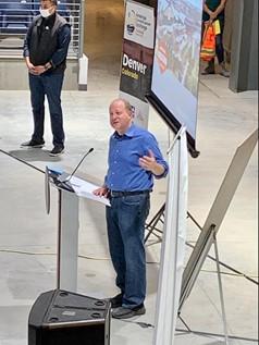 Colorado Gov. Jared Polis speaks to the ACE Colorado delegation at the National Western Center