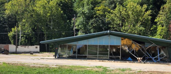 Aftermath of a tornado in Kentucky, December 2021. Picture of a building destroyed by tornado.