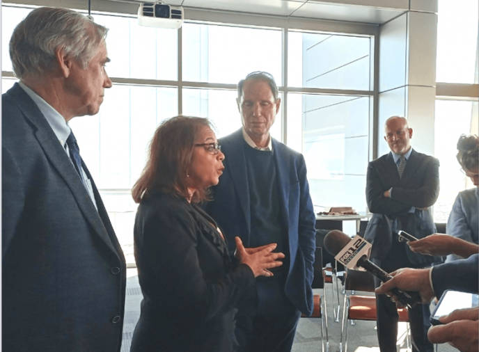 In 2022, Assistant Secretary of Commerce for Economic Development Alejandra Y. Castillo (second from left) joined Senator Jeff Merkley (left) and Senator Ron Wyden (third from left) to announce a $41.4 million grant to expand Oregon’s emerging mass timber industry. 