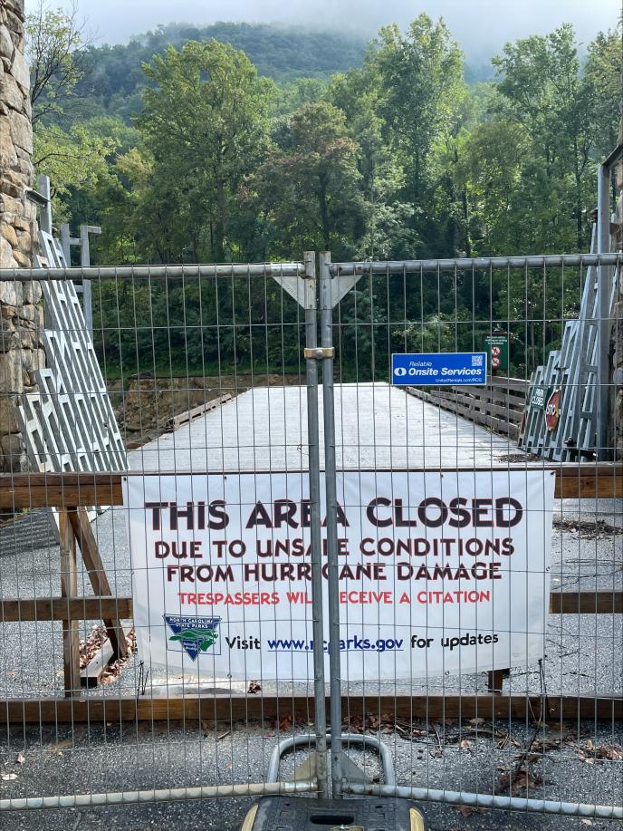 Photo of closed off area with sign saying This Area Closed due to unsafe conditions from hurricane damage