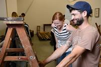 Makers Jeremiah Jones of Sewlab USA and Rachel Bone from Red Prairie Press set up for the Pop-Up Shop.