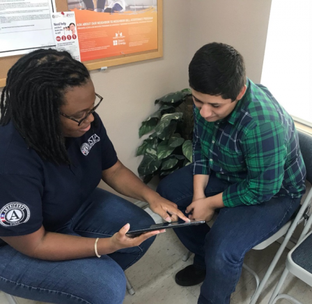 Angela Bonner speaks with community resident in South Texas