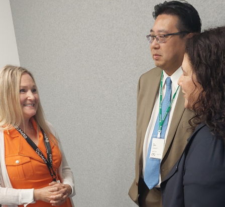 Photo of Kristina Hudson (left) speaking with Isabella Casillas Guzman, Administrator of the U.S. Small Business Administration (SBA), and SBA Region X Administrator Mike Fong during their visit to OneEastside Spark in July 2022.