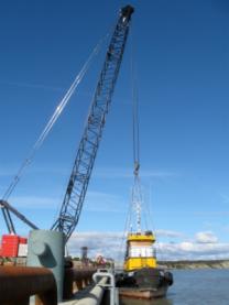 New Port of Bristol Bay crane pulling tug boat out of the water at the end of the season