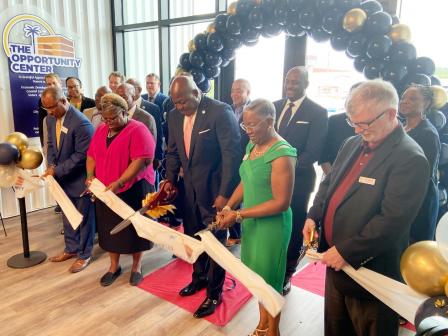 Leaders from the four partners in The Opportunity Center, pictured left to right: Bernie Mazyck, SCACED; Dr. Jennie Stephens, Center for Heirs Property Preservation; Jerome Heyward, Mayor Pro Tempore of North Charleston; Dorothea Bernique, Increasing HOPE; and Don Oglesby, Homes of Hope, gather to cut the ceremonious ribbon, marking the official opening of the new building.