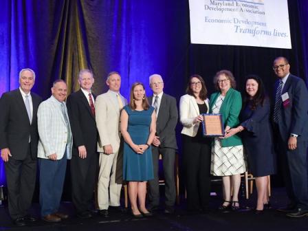 The Eastern Shore Economic Recovery Project Team receives the 2022 Maryland Economic Development Association (MEDA) Award. Pictured are John Wasilisin, Danny Thompson, Scott Warner, Greg Padgham, Erin Silva, Dan McDermott, Susan Banks, Debbie Bowden, Cassandra Vanhooser and Gordon Knox. Photo by Rick Lippenholz.