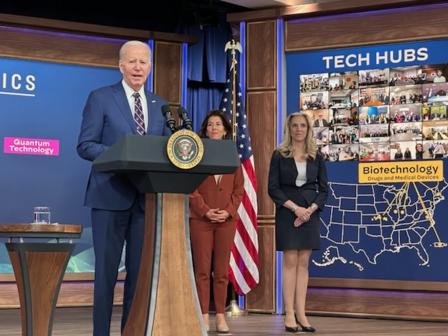 Photo of President Biden speaking from behind a podium, announcing the designation of the inaugural Tech Hubs and Strategy Development Grants.