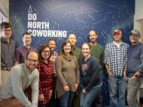 Evan Carlson (lower left) and the staff of Do North Coworking.