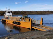 The Nukalpiaq delivering wood products along the Kuskokwim River to support the economy of the Native Village of Napaimute in Alaska.